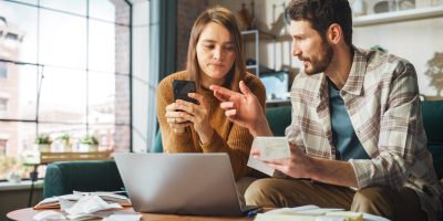 Stressful Dramatic Accounting at Home: Couple Using Laptop Compu